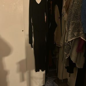 Long sleeve bodycon black dress with belt. Length to ankles. Size L